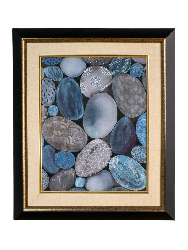 Framed painting of hand-painted pebble shapes in shades of blue and grey, each with a distinct textured pattern, on natural linen in a black and gold frame — Tangled Monk original hand-drawn art