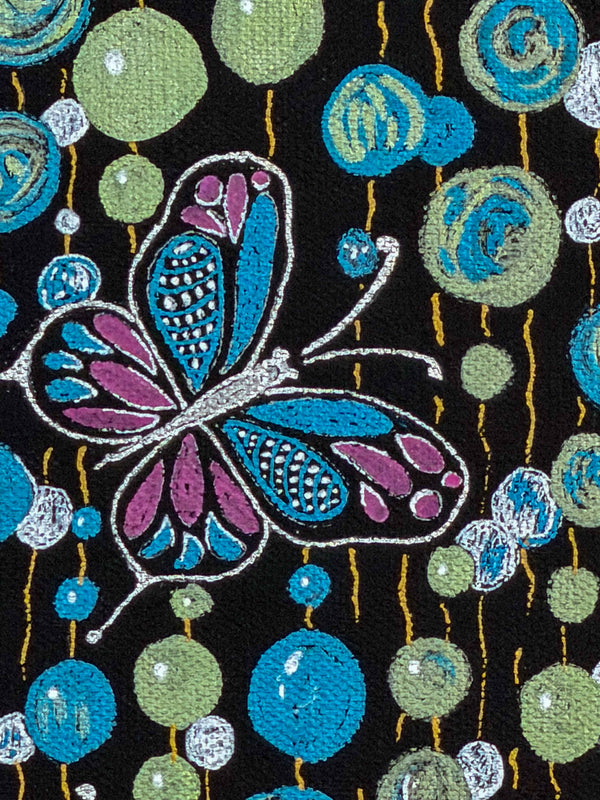 Close-up of a butterfly drawn in magenta, blue and white linework among turquoise and sage dots on black canvas — Tangled Monk original hand-drawn art