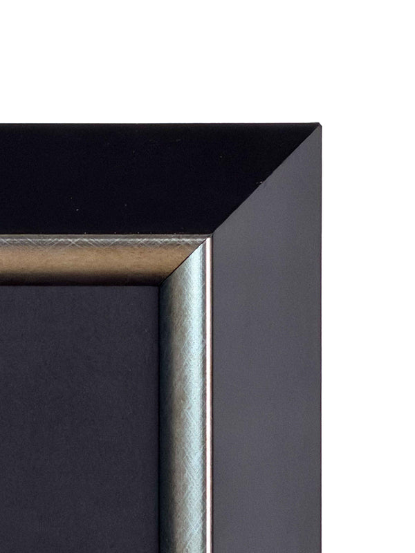 Corner detail of the black wooden frame with a silver inner edge and black mount — Tangled Monk framed wall art
