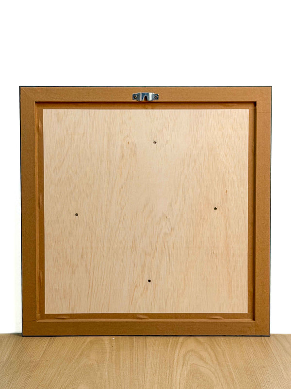 Reverse of the framed artwork showing the wooden backing board and metal hanging fixture — Tangled Monk framed wall art